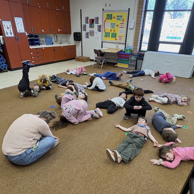 kindergarteners practicing yoga movements 