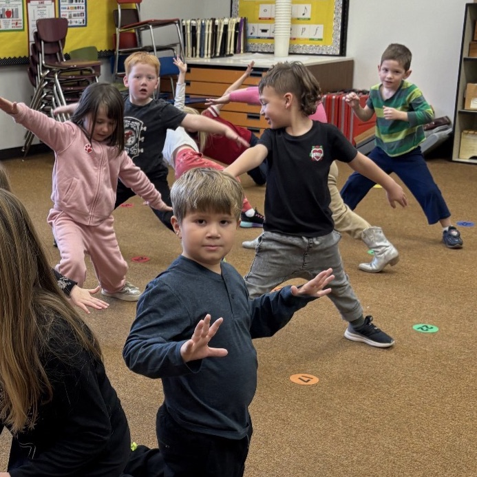 kindergarteners practicing yoga movements 