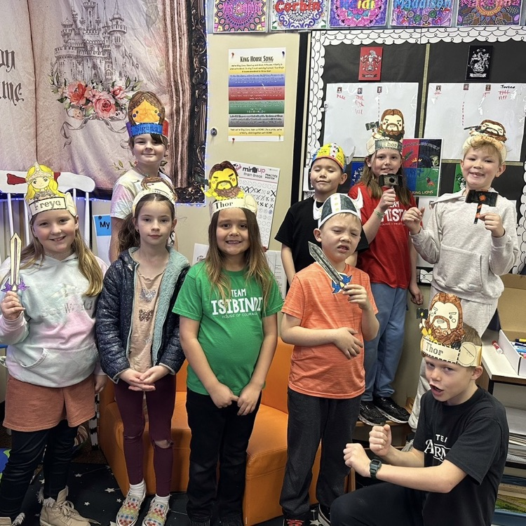 students showing their artwork to demonstrate learning from their Viking unit in CKLA Knowledge.