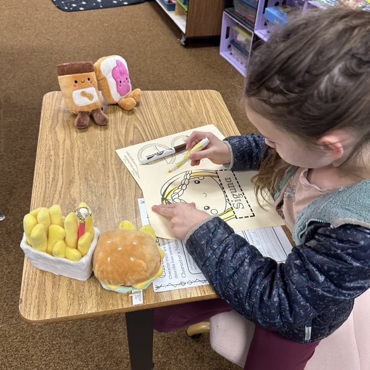 students showing their artwork to demonstrate learning from their Viking unit in CKLA Knowledge.