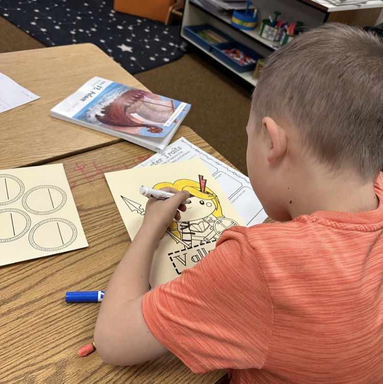 students showing their artwork to demonstrate learning from their Viking unit in CKLA Knowledge.