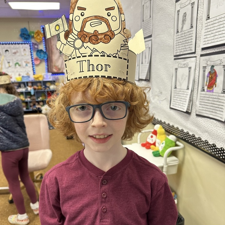 students showing their artwork to demonstrate learning from their Viking unit in CKLA Knowledge.