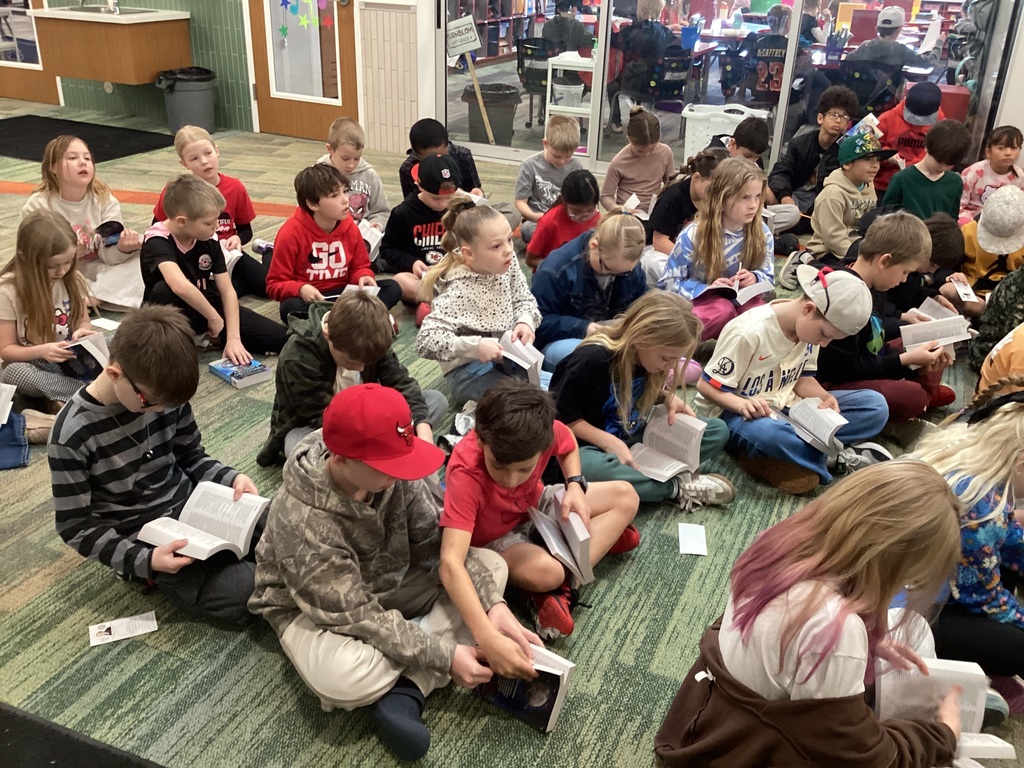 Students looking through dictionaries. 