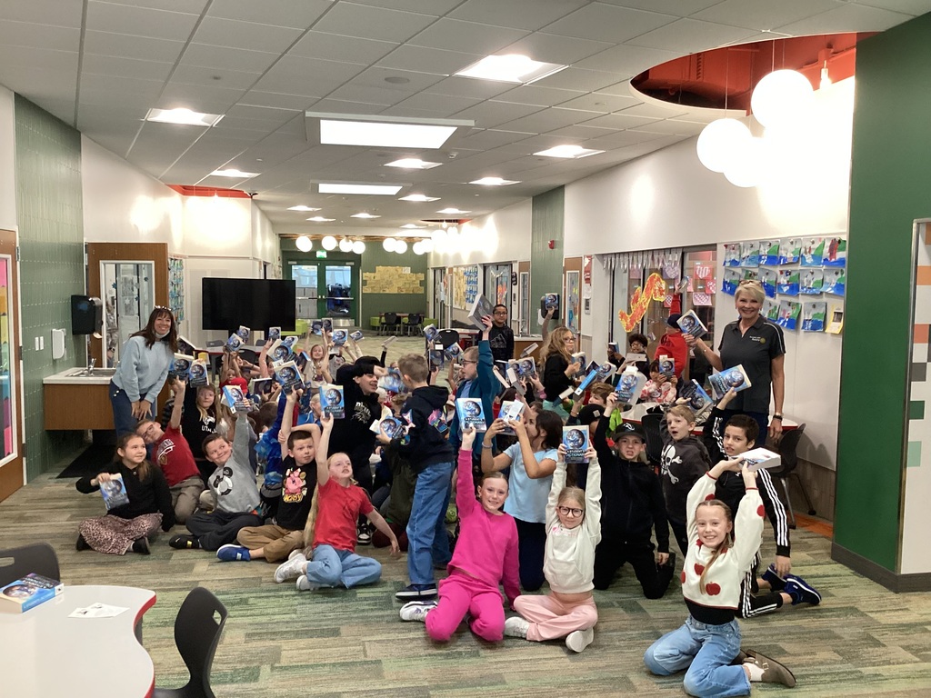 Students posing with their dictionaries from Bountiful Rotary Club.