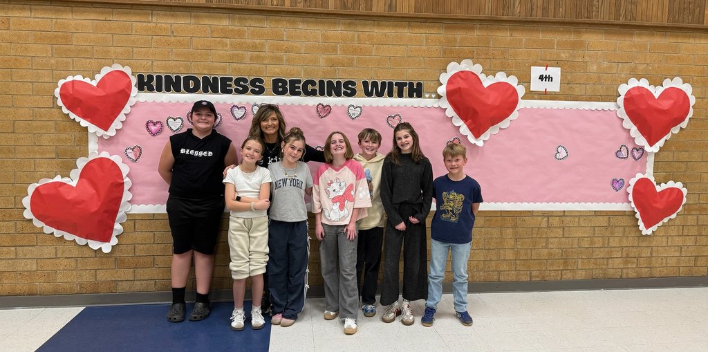 Students posing with principal for Kindness Week
