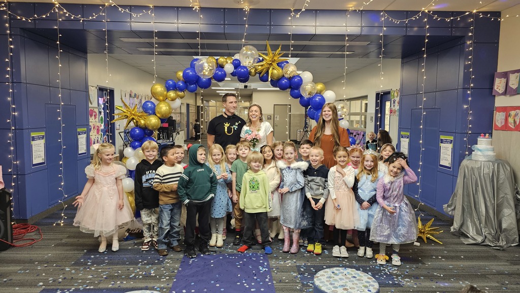 group of students in front of U and bride
