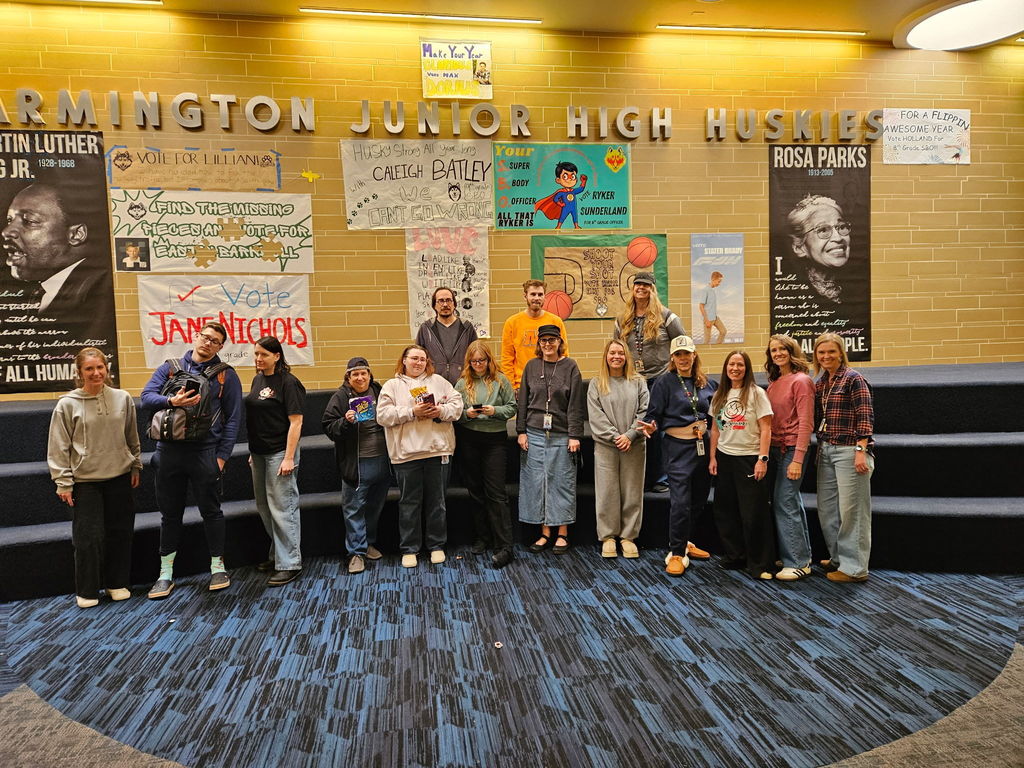 15 male and female teachers dressed up as students for spirit day in the commons.