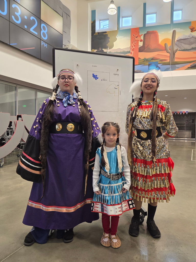 Native American girls in their native dress. 