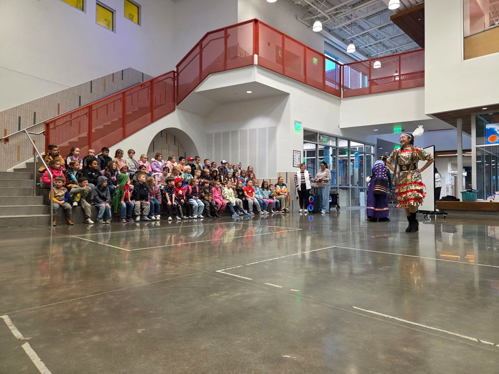 Kindergarten watching Native American presentation.