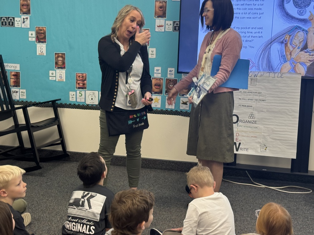 teacher receiving award from school board member