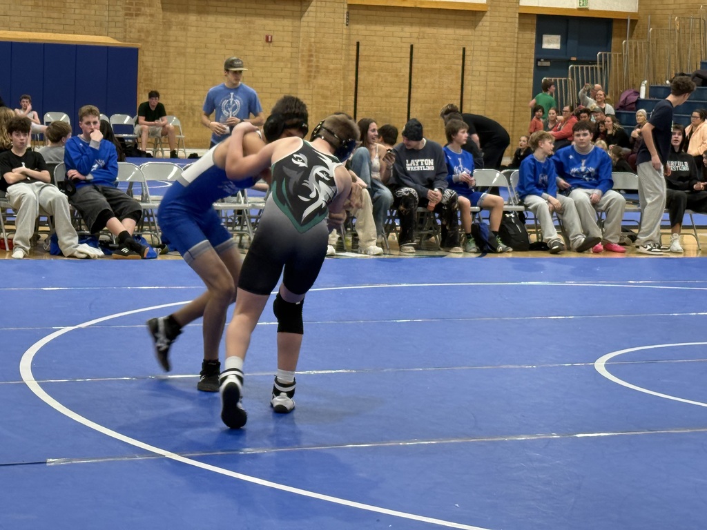 Farmington wrestler taking down a Fairfield student. 