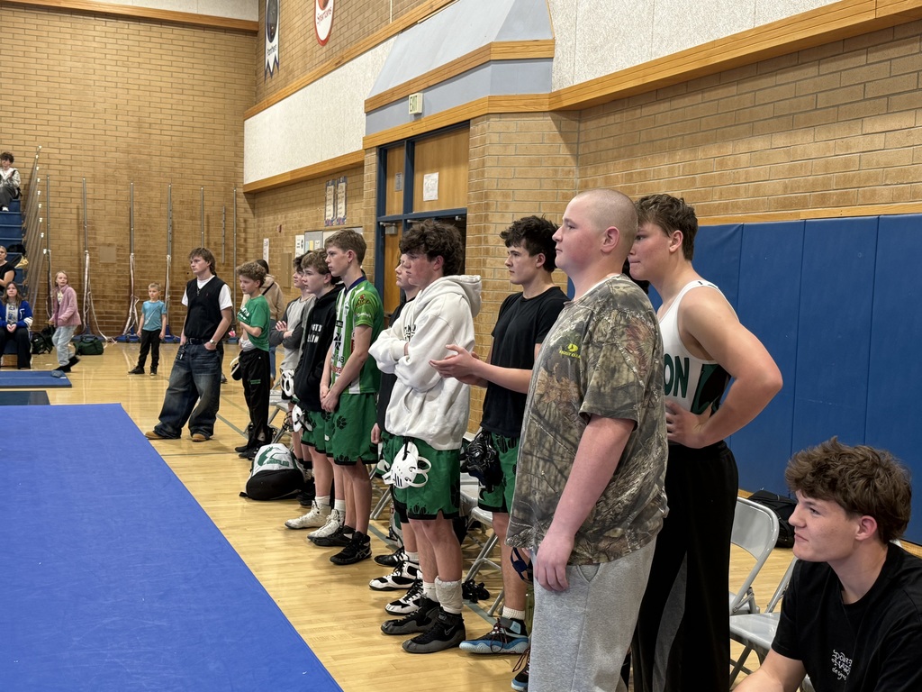 FJH wrestlers watching their teammates perform. 