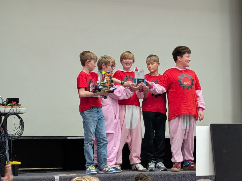 students on stage receiving award at VEX competition