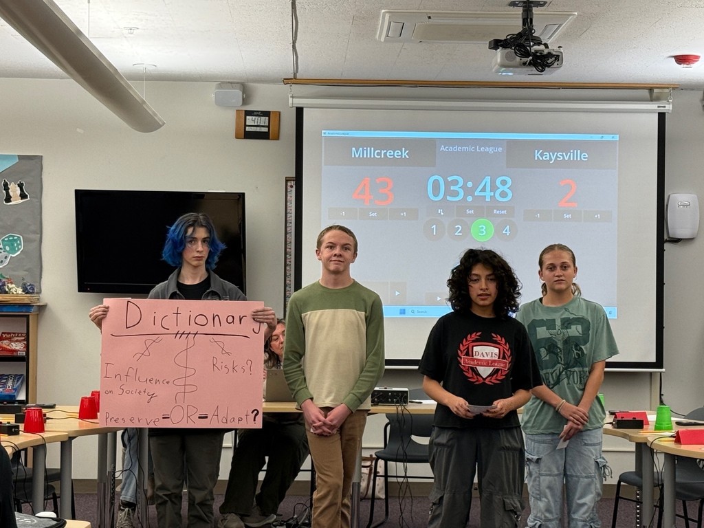 image of students holding a poster