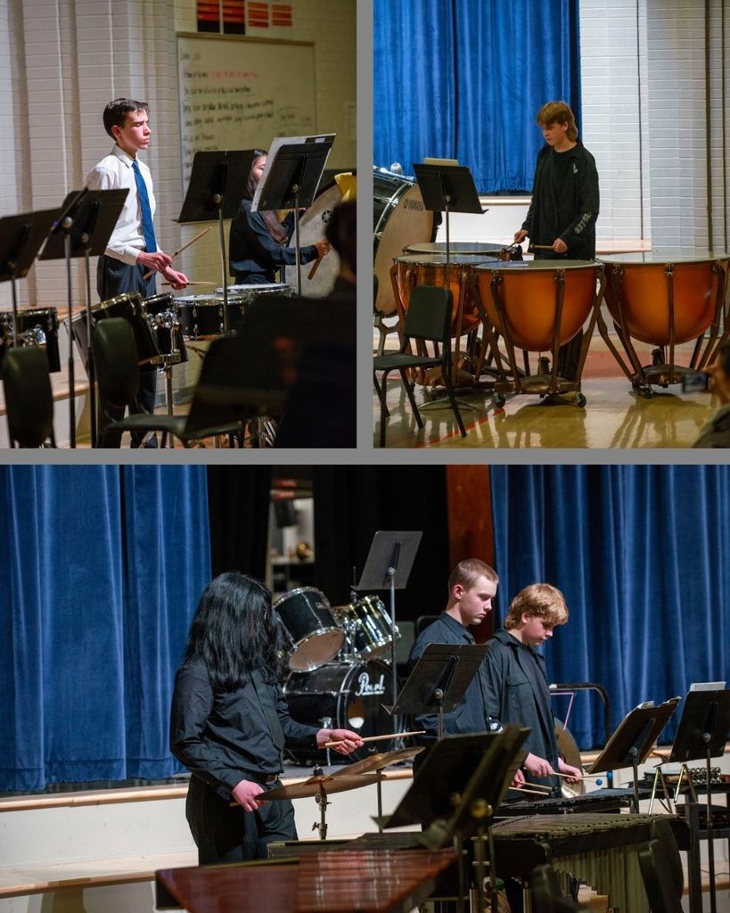 Band students playing different types of drums during a performance