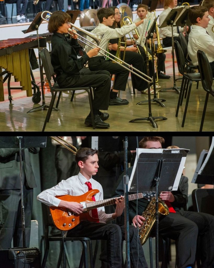 Band students performing. A student with a guitar and another student with a trumpet