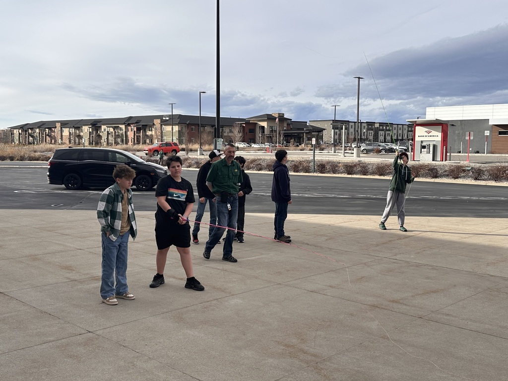 Practicing casting with fishing rods. 