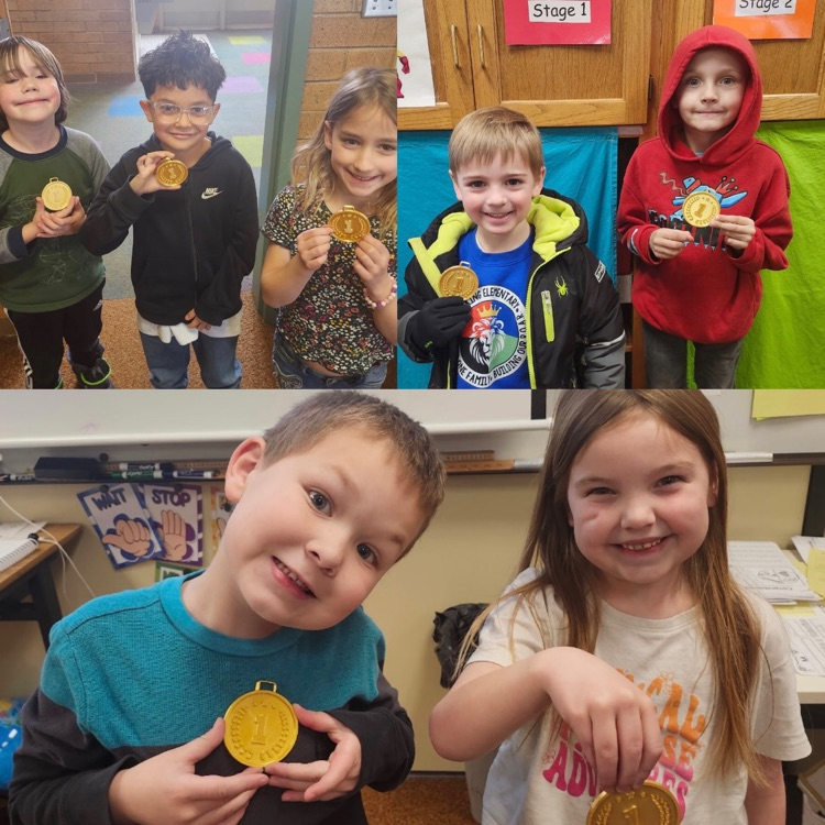 Students showing off their gold medals they won during STEM Olympics 
