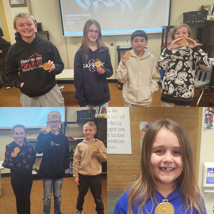 Students showing off their gold medals they won during STEM Olympics 