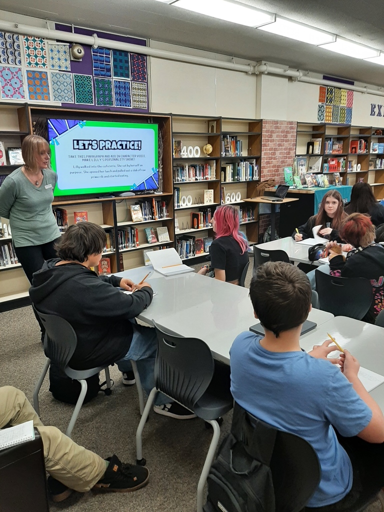 Students in the library receiving instruction