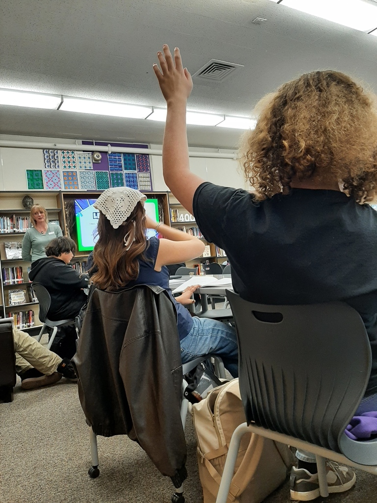 Students in the library receiving instruction