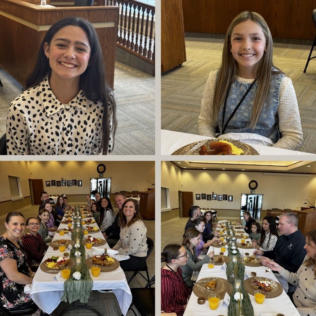 Students eating food and having a discussion at a round table with city leaders.
