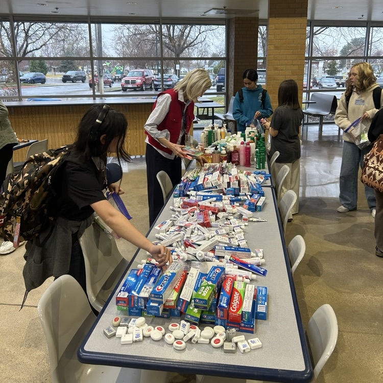 service club putting together hygiene kits