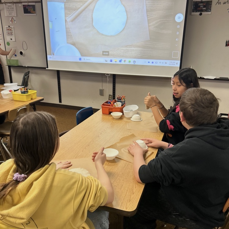 6th graders working on a pottery project 