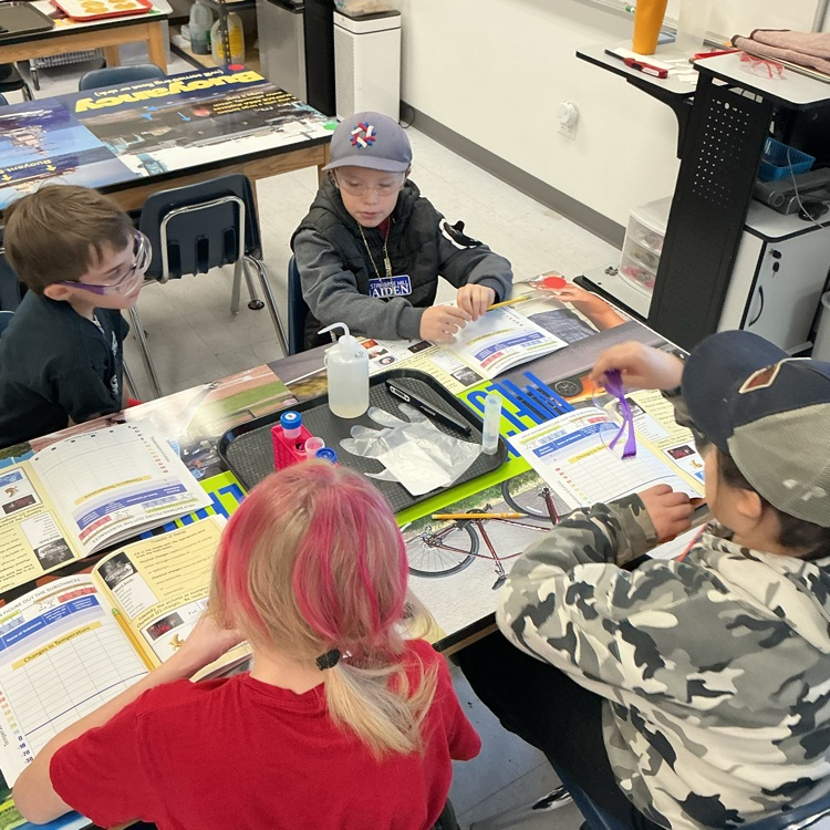 Students figuring out what the mystery substance is.