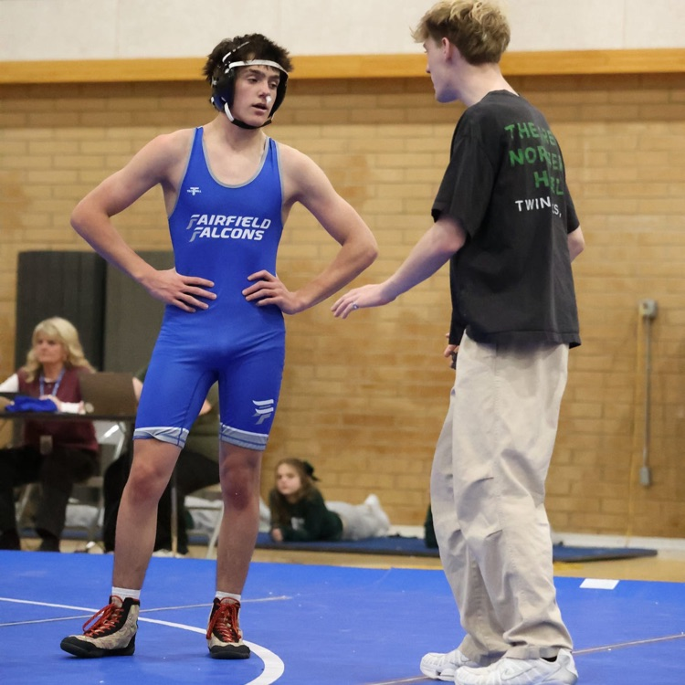 FFJH wrestler talking with coach