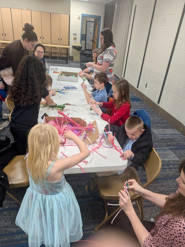 Students working with pipe cleaners.