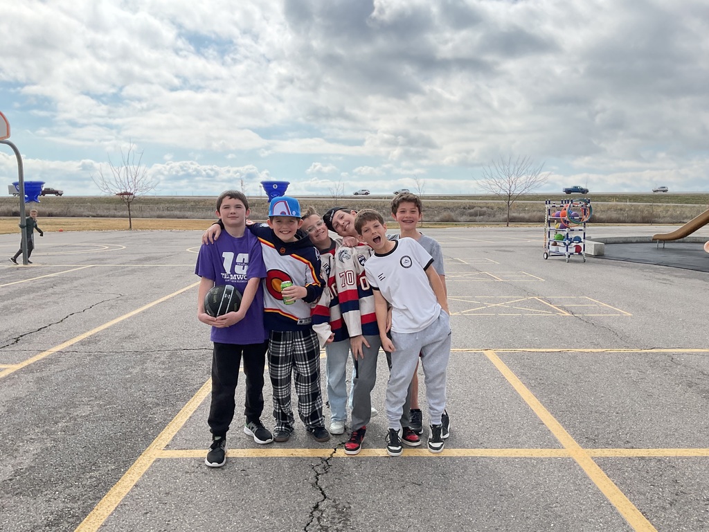 students photographed outside on the playground