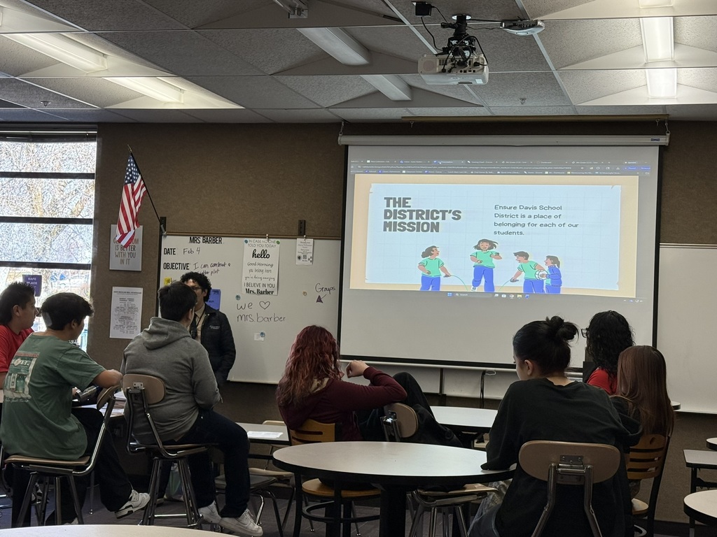 Students in a Classroom looking at a screen
