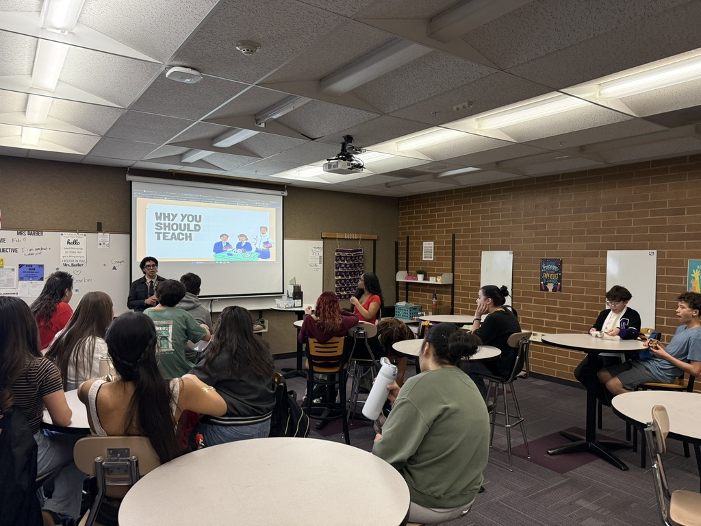 Students in a Classroom looking at a screen