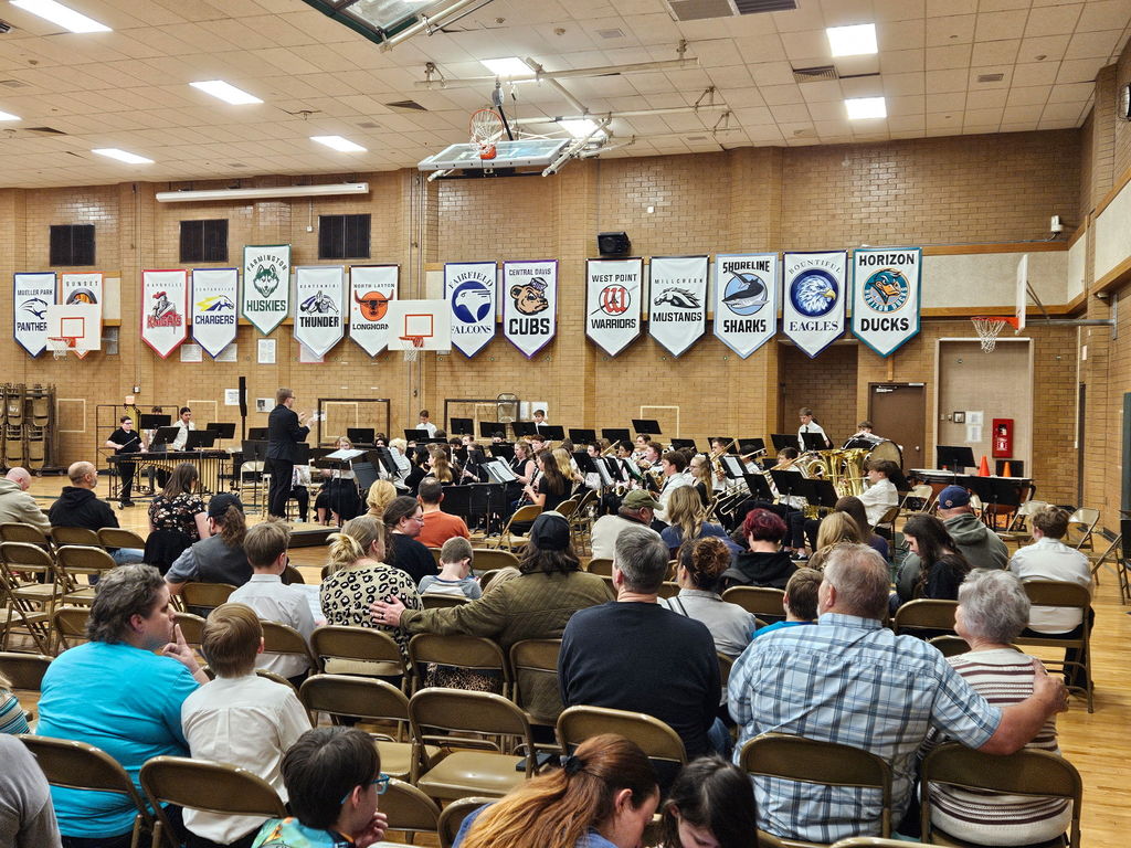 Another picture of different band students playing at the concert. 