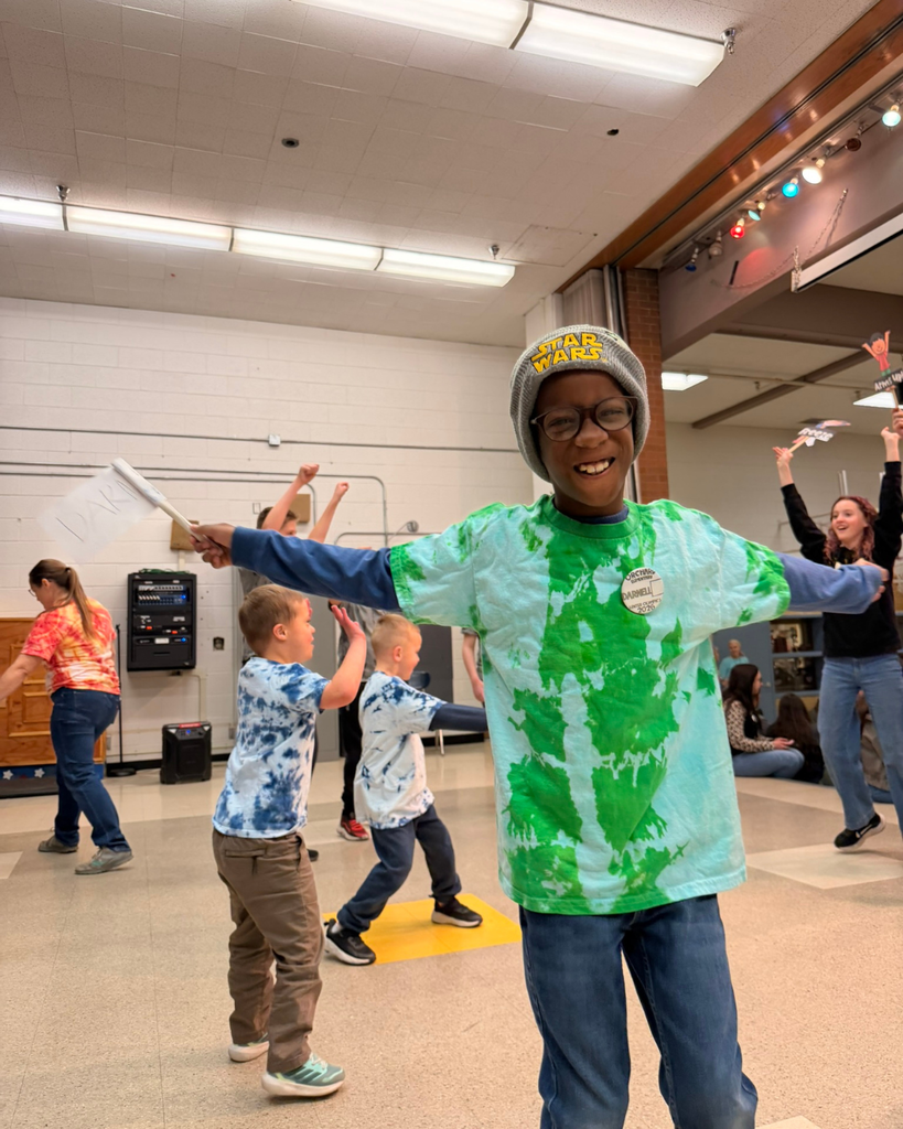 Student spreads arms wide during ASC olympic event