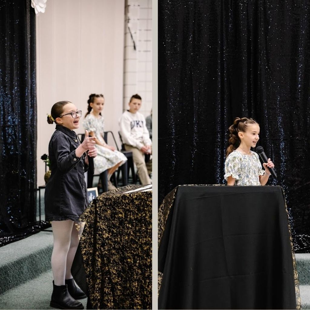 Students present speeches in front of a crowd.