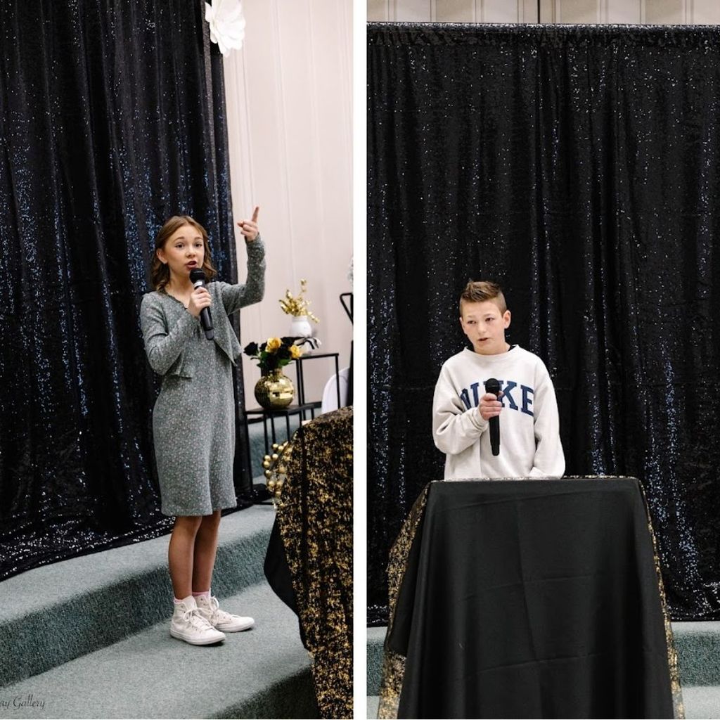 Students present speeches in front of a crowd.