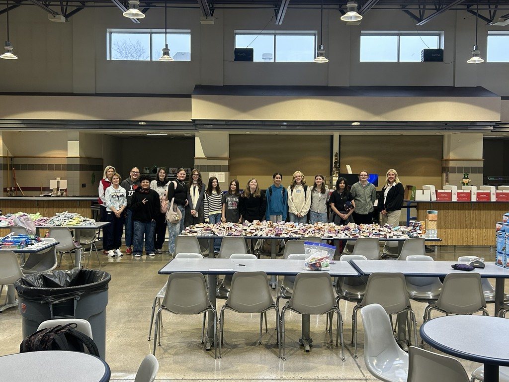 Students and Admin with supplies for hygiene kits