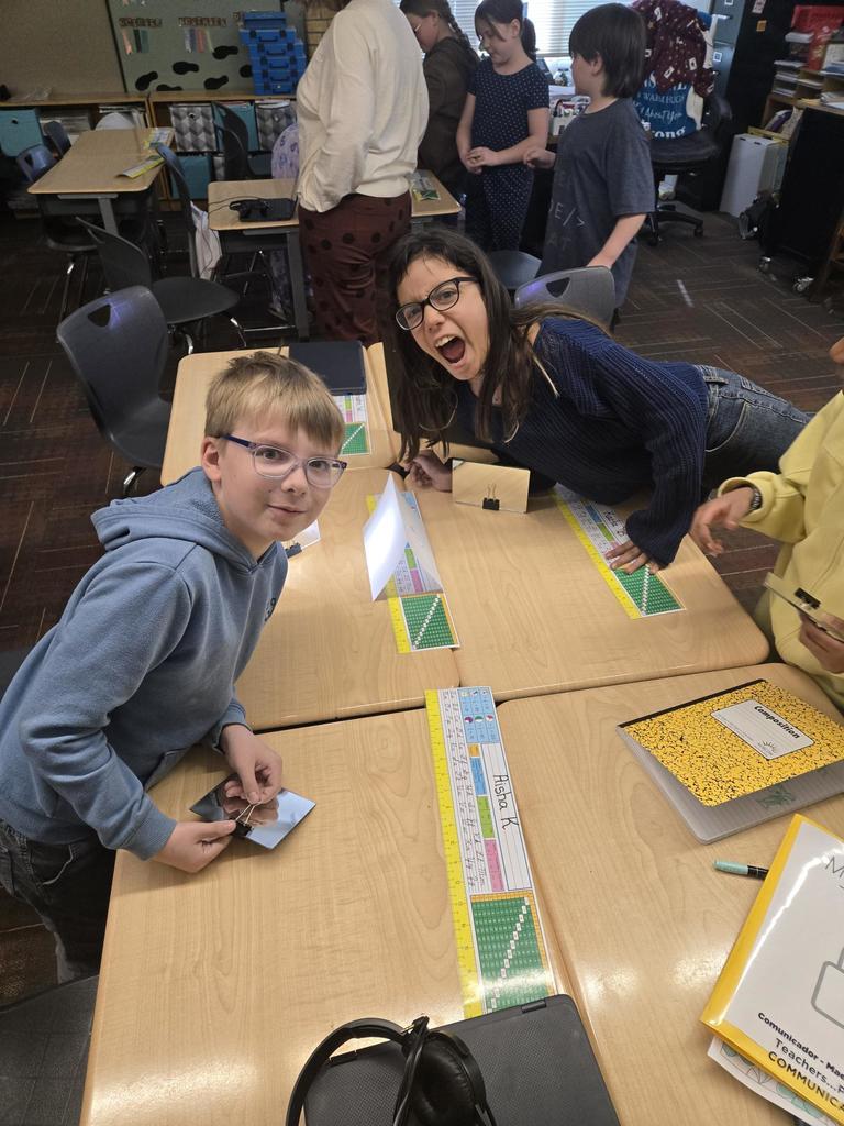group of 4th graders working on a science project