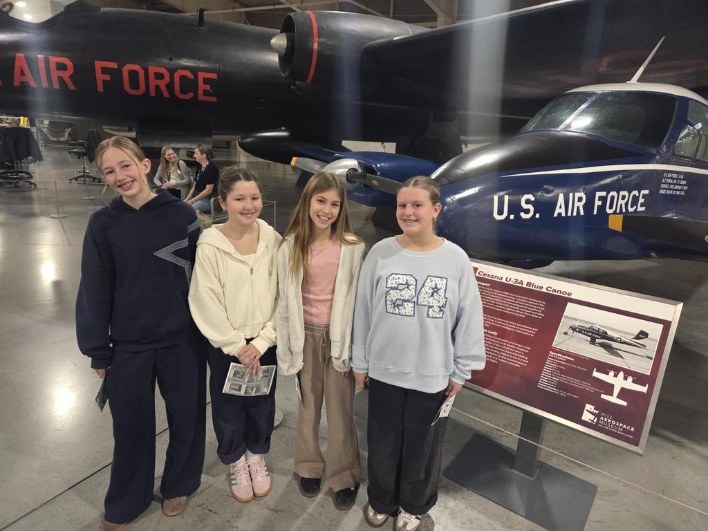 Groups of sixth grade students pictured with planes at the HAFB Aerospace Museum.