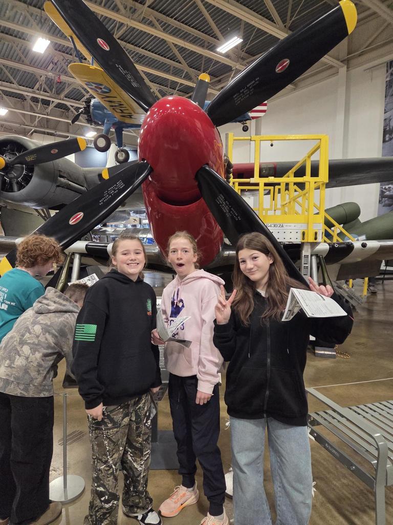 Groups of sixth grade students pictured with planes at the HAFB Aerospace Museum.