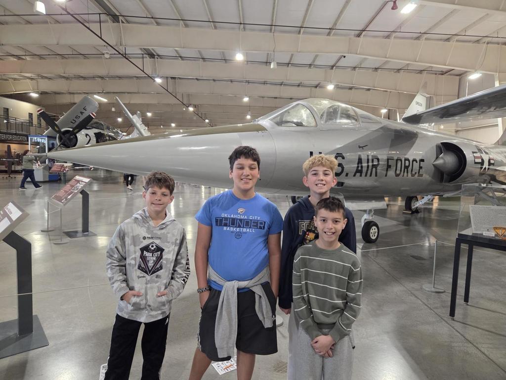 Groups of sixth grade students pictured with planes at the HAFB Aerospace Museum.