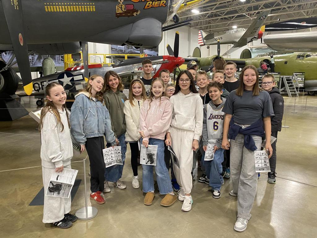 Groups of sixth grade students pictured with planes at the HAFB Aerospace Museum.