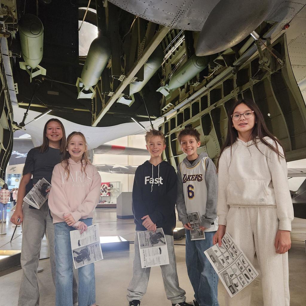 Groups of sixth grade students pictured with planes at the HAFB Aerospace Museum.