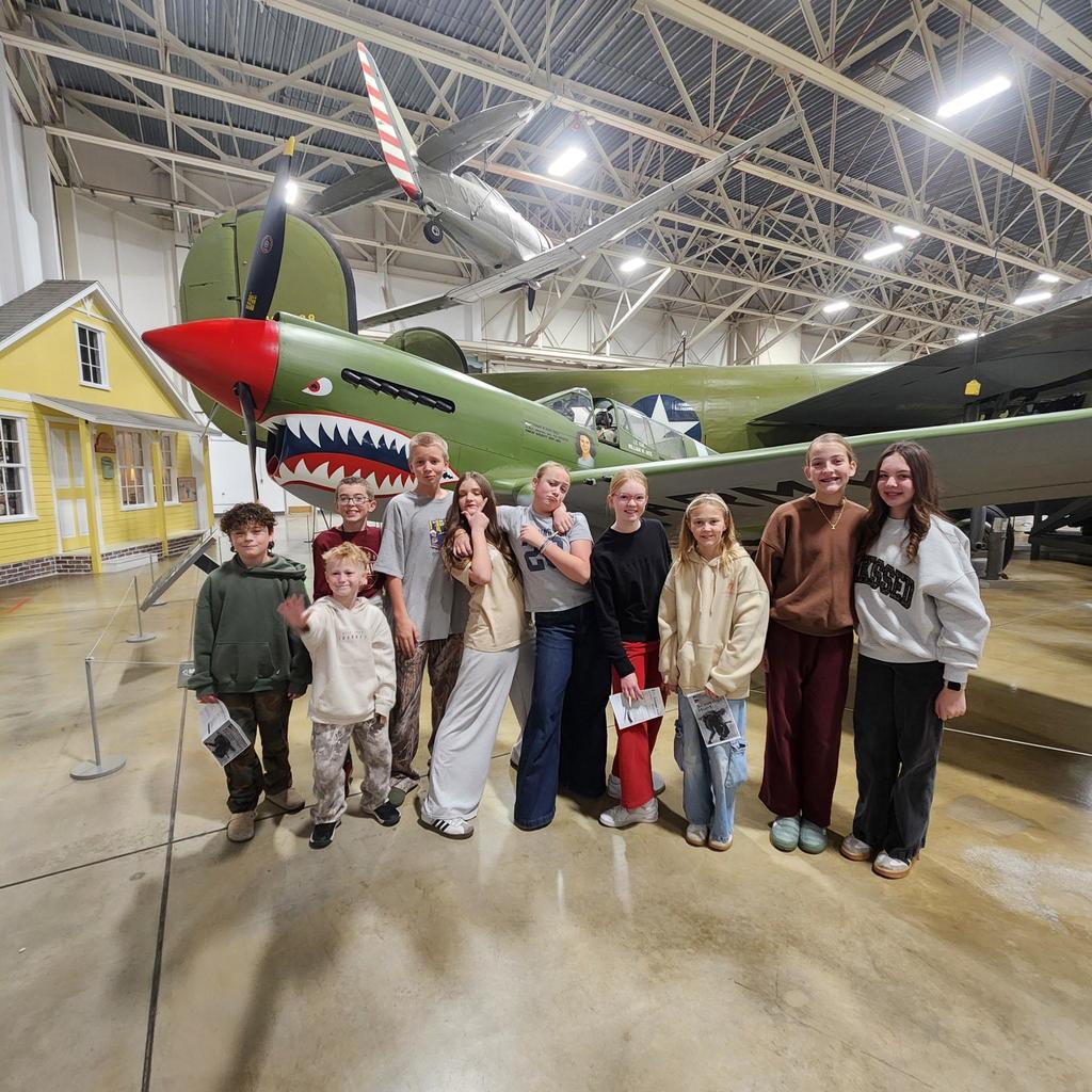 Groups of sixth grade students pictured with planes at the HAFB Aerospace Museum.