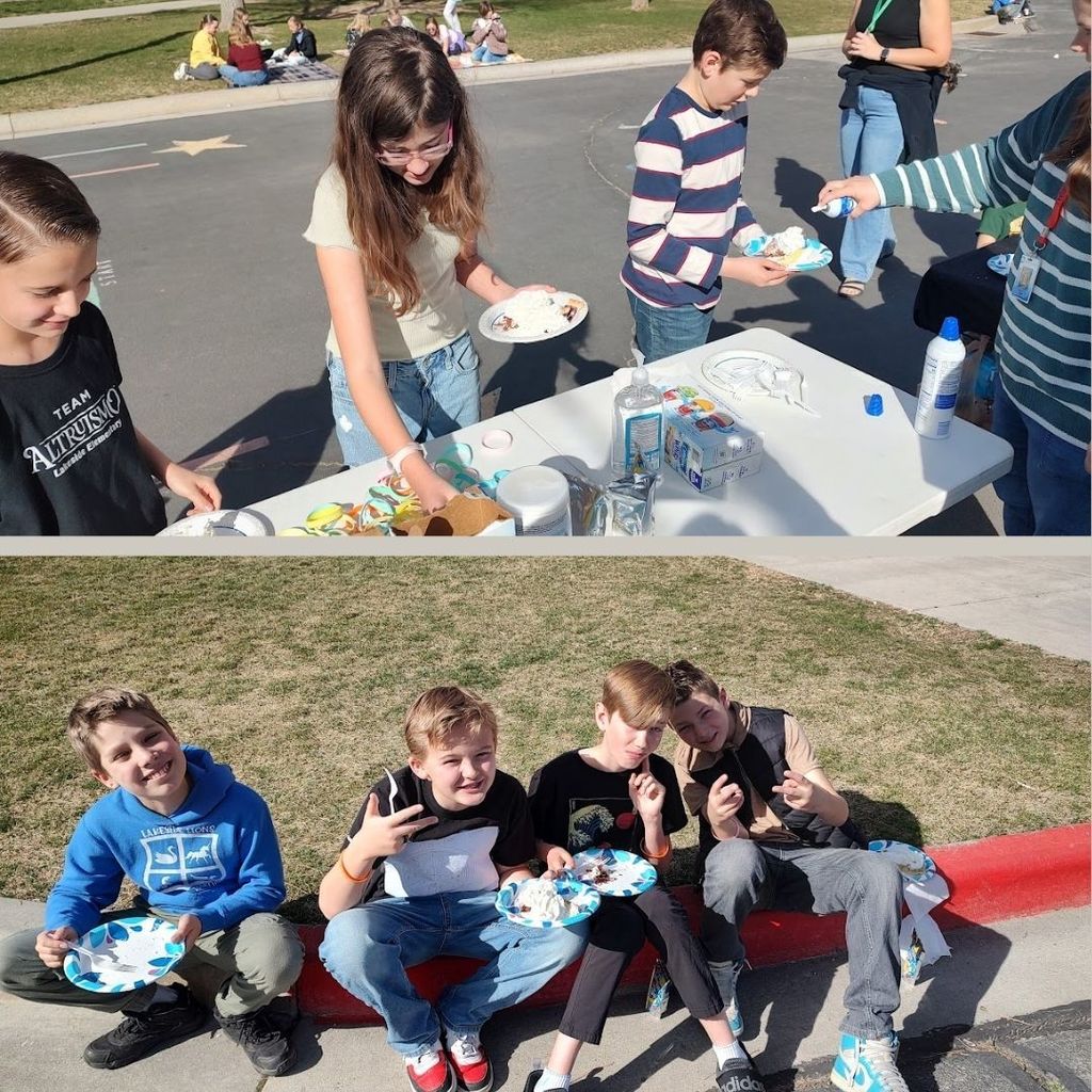 Students sitting outside eating pie.
