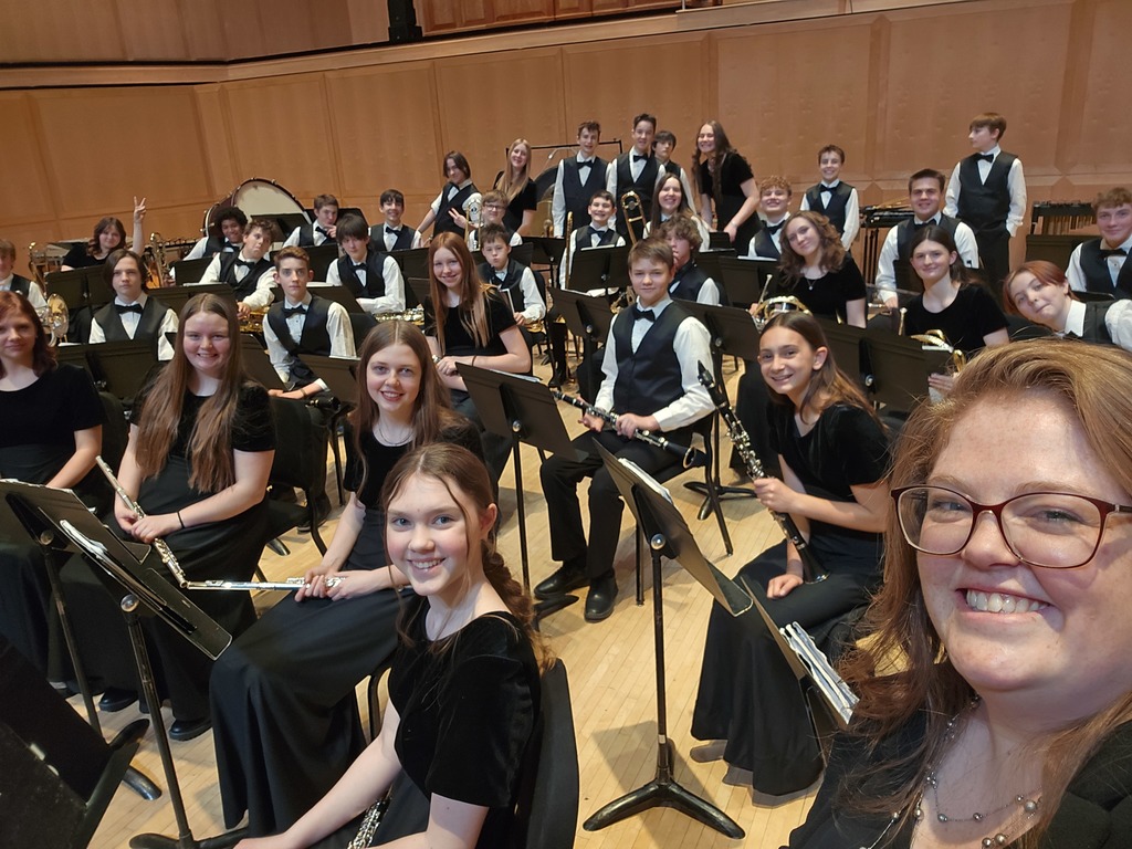Symphonic Band warming up with their Band Director, Kaitlin Landen.