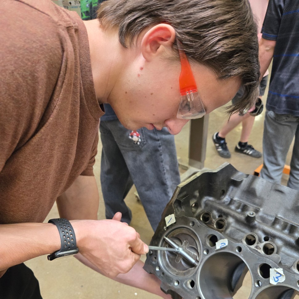 a student working on an engine