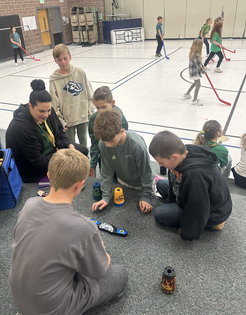 students practicing cup stacking